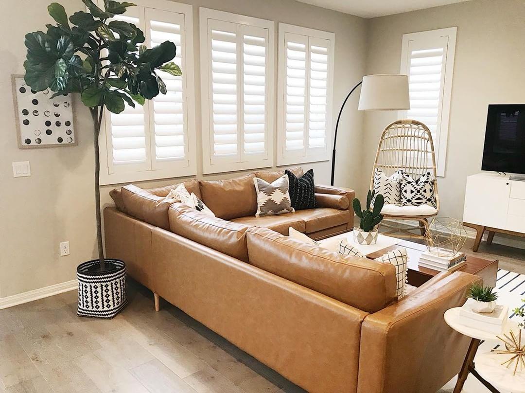 Cozy living room with our Polywood shutters in Denver.